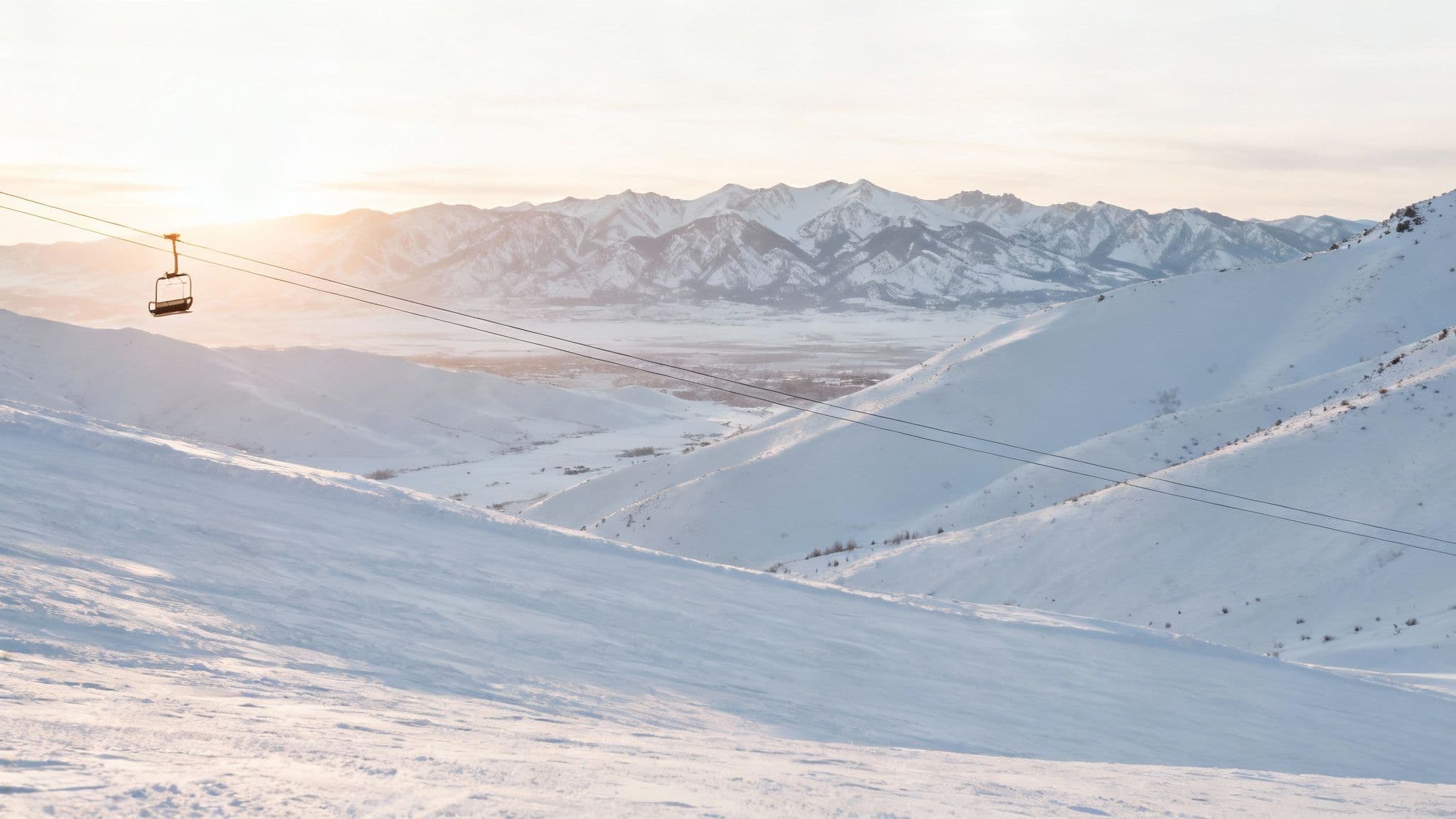 A skier gliding through deep, fresh powder snow in Utah's mountains.
