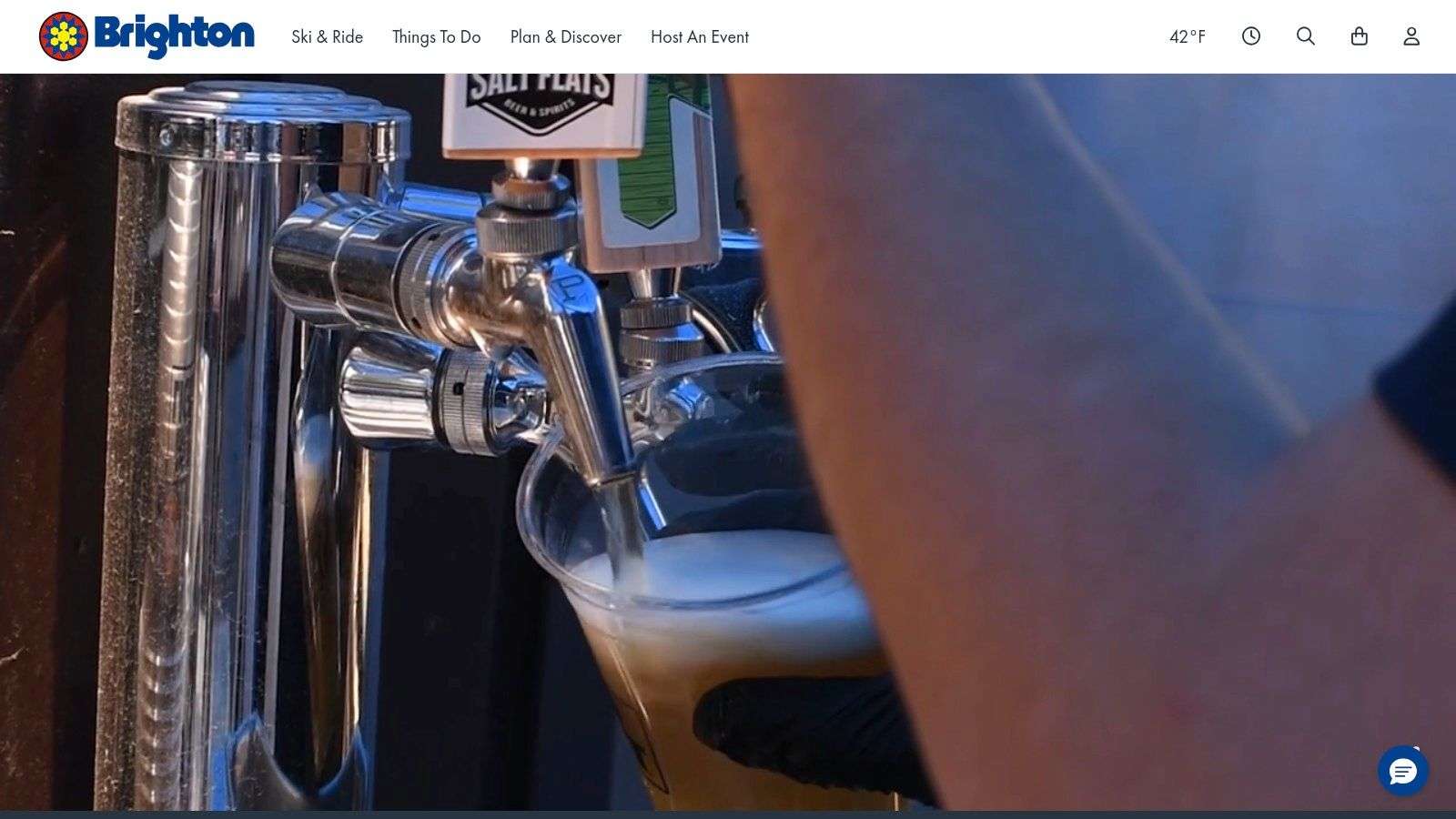 Snowboarder on a terrain park feature at Brighton Resort during a night skiing session.